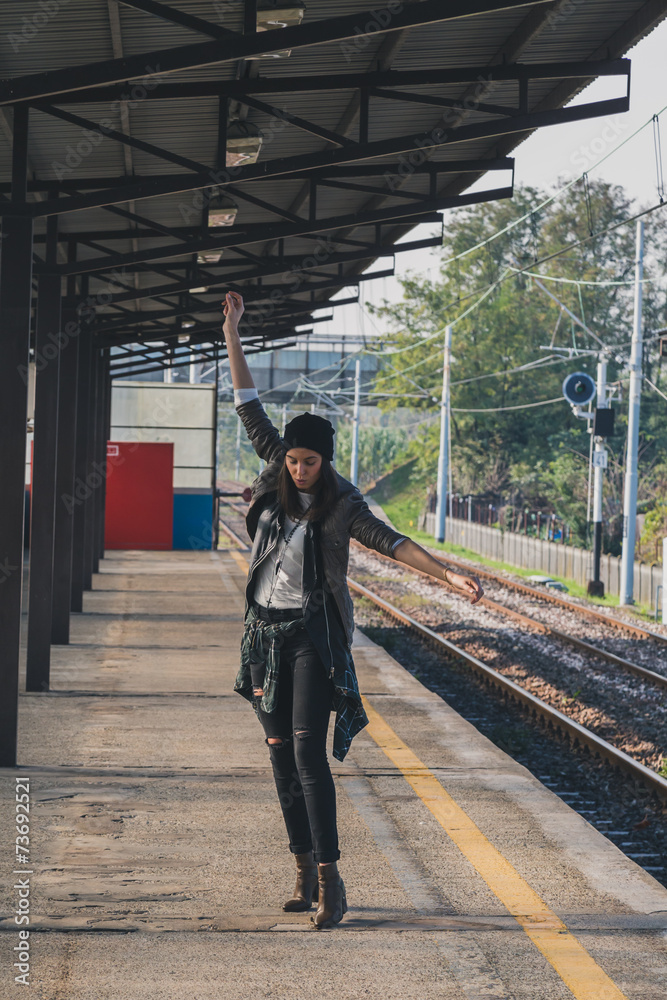 Pretty girl posing in a metro station Pretty girl posing in a metro station