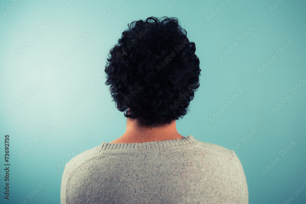 Rear view of man with curly hair
