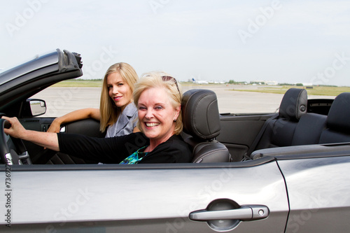 Two women ready to drive convertible © Trish23