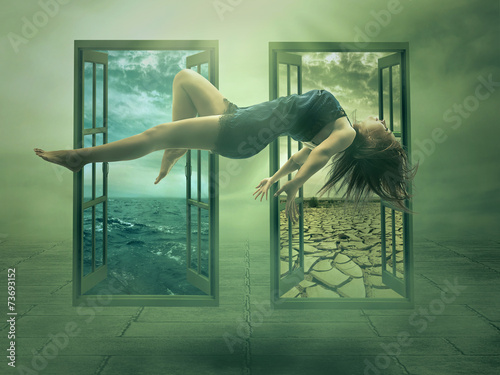 Levitation portrait young woman in her house photo