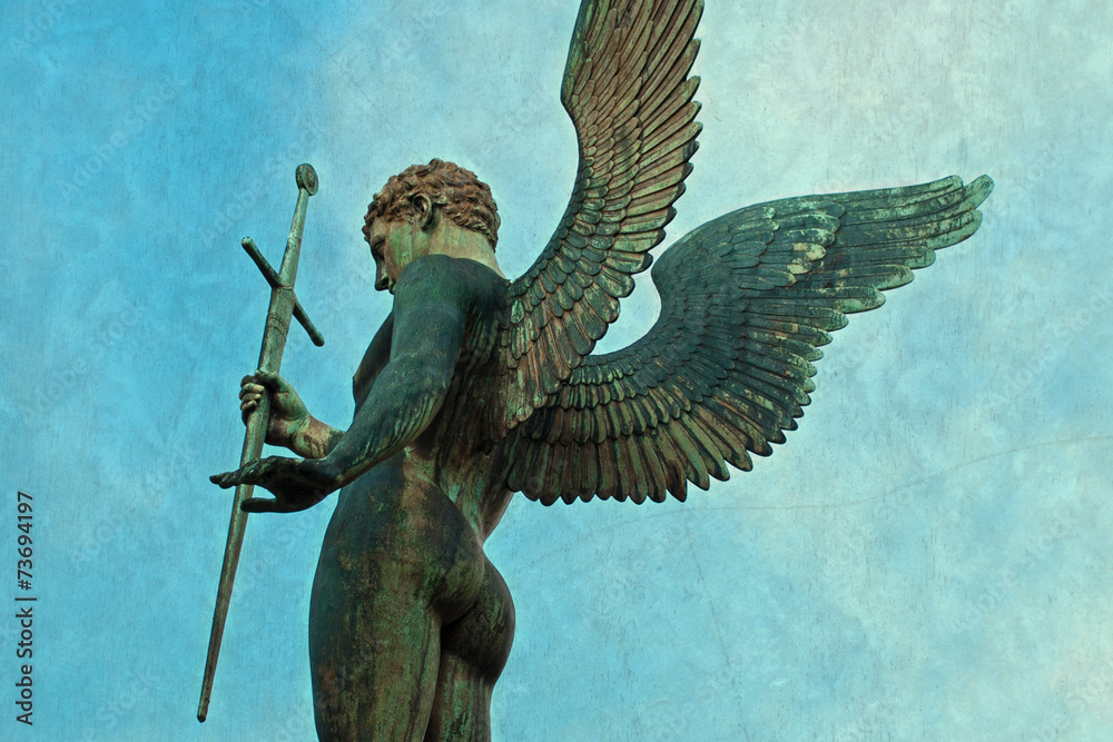 Male angel statue with sword with background texture Stock Photo