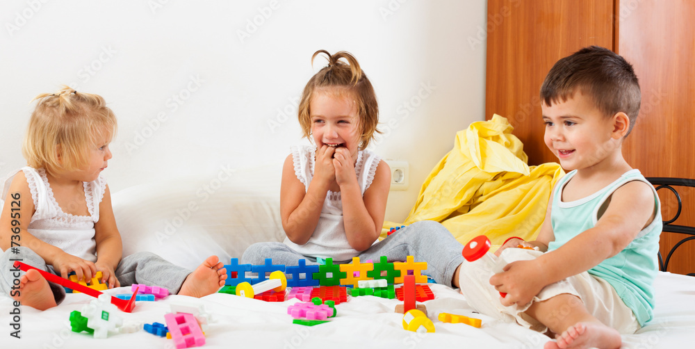 children playing on bed children playing on bed