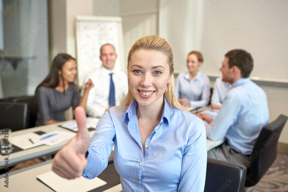 group of smiling businesspeople meeting in office group of smiling businesspeople meeting in office