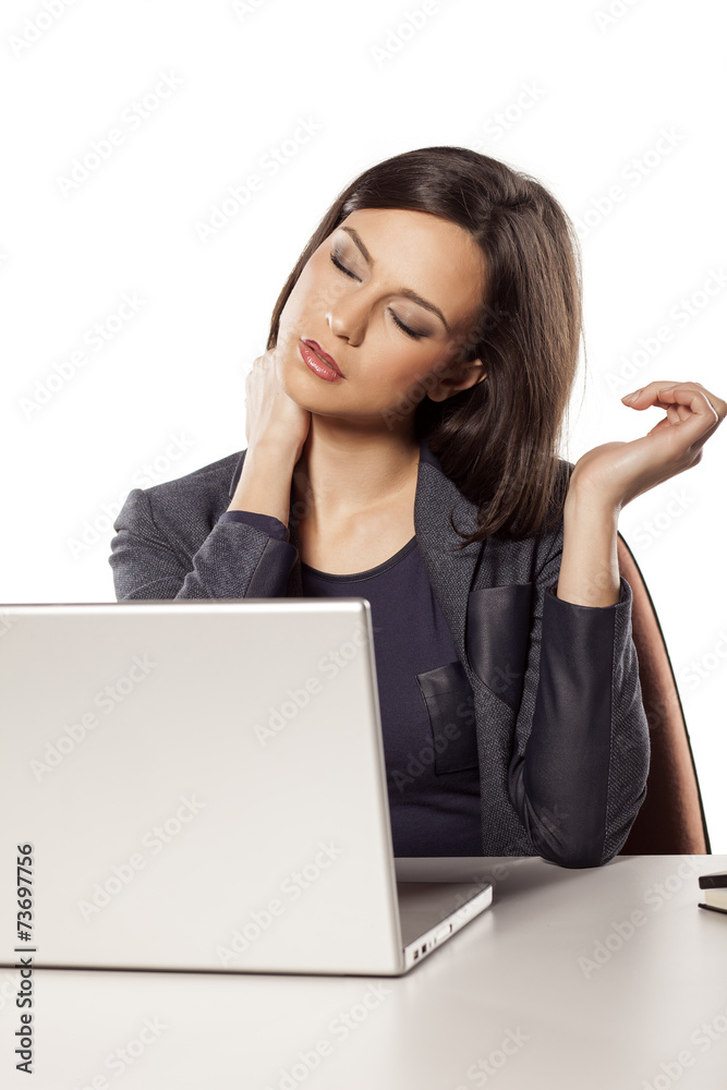 young beautiful businesswoman has a pain in the neck young beautiful businesswoman has a pain in the neck