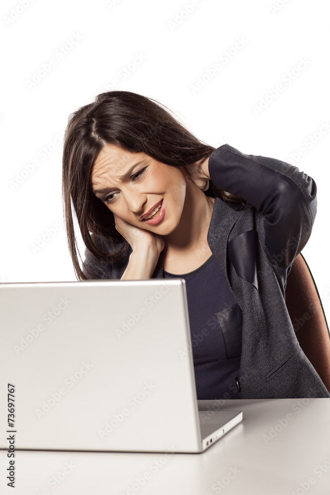 young beautiful businesswoman has a pain in the neck young beautiful businesswoman has a pain in the neck