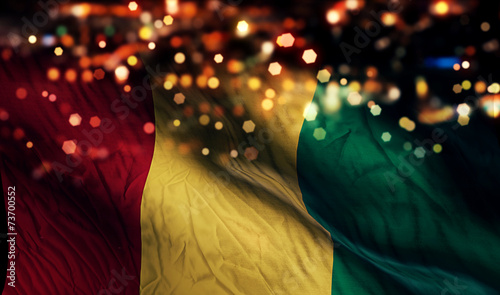Guinea National Flag Light Night Bokeh Abstract Background photo