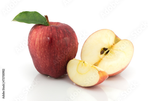 red apples and half of apple on a white background