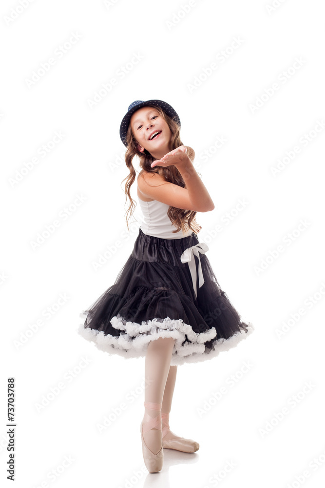 Naklejka premium Cute young ballerina sends air kiss to camera