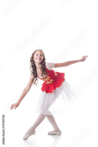Merry ballerina looking at camera while dancing