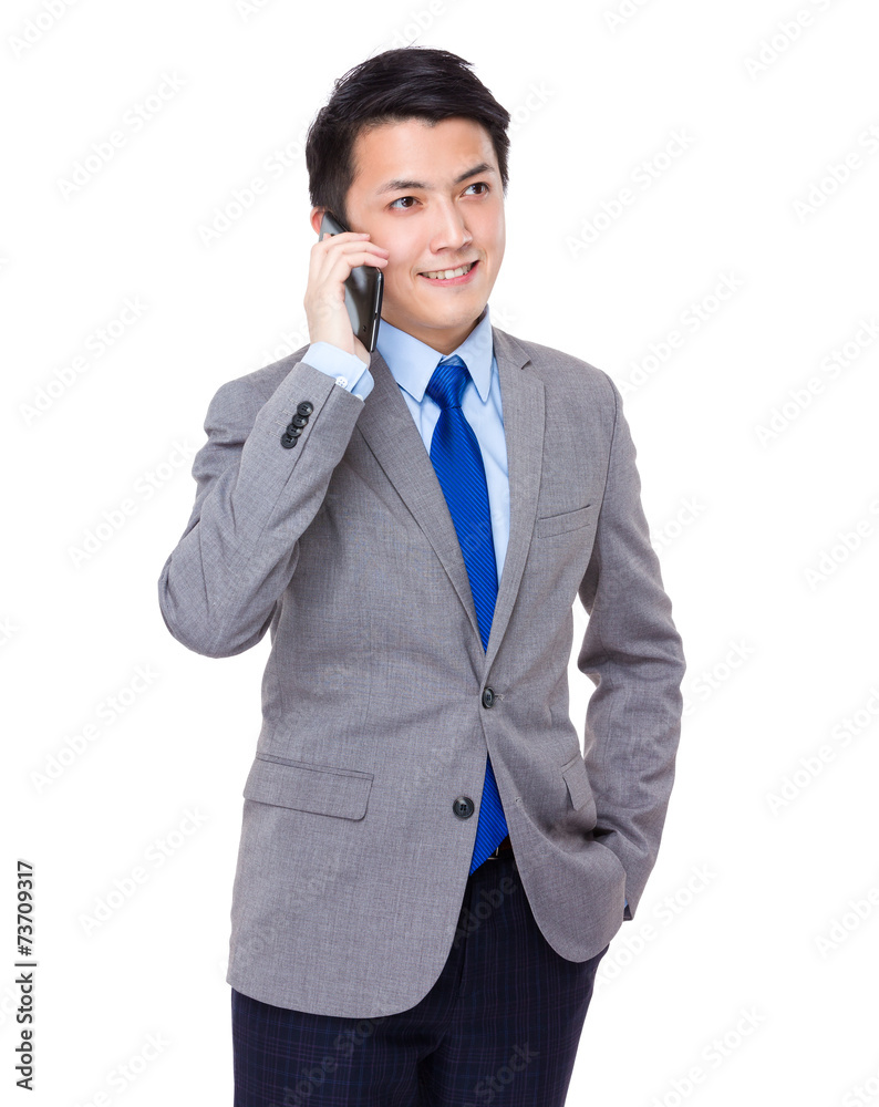 Business man talk to cellphone Business man talk to cellphone