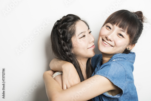 Two smiling asian girls
