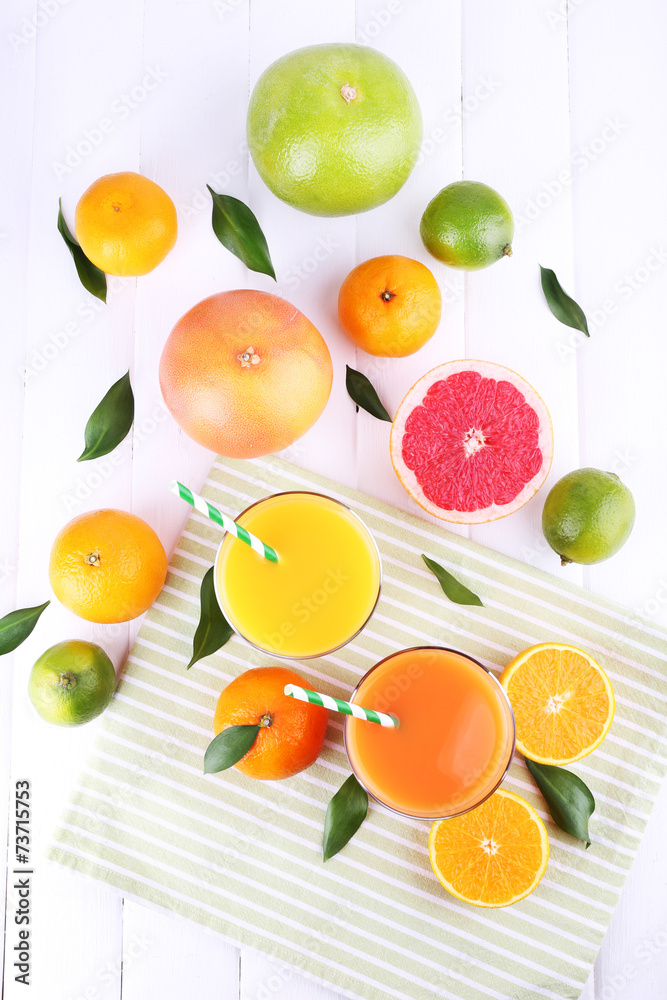 Juices and many citrus close-up Juices and many citrus close-up