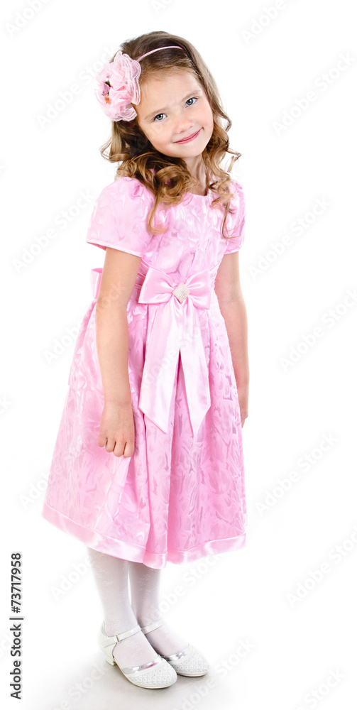 Adorable smiling little girl in pink princess dress