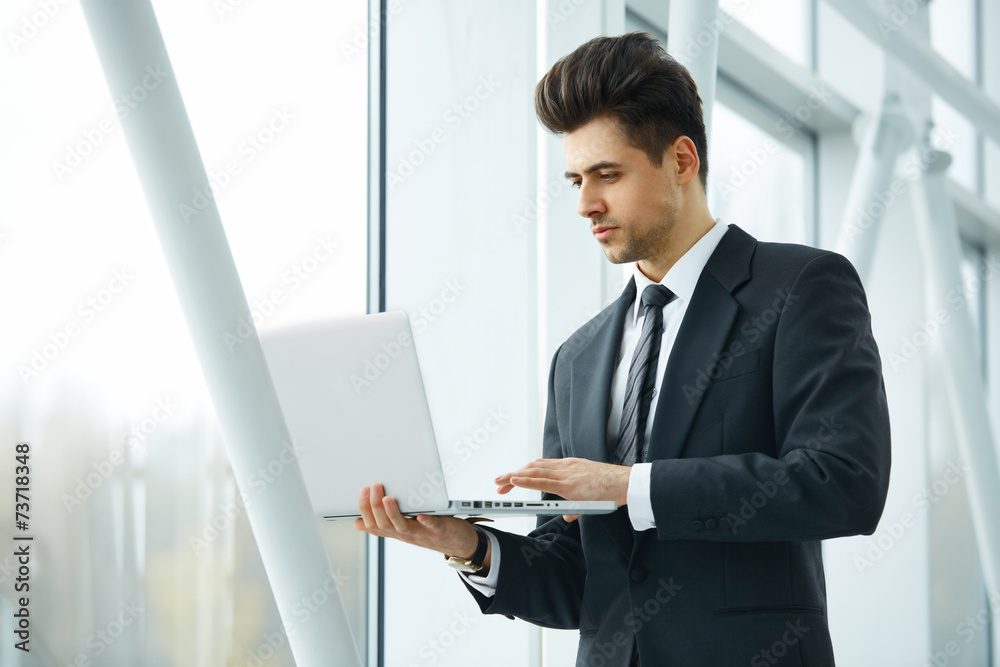 Businessman Working at his Laptop. Businessman Working at his Laptop.