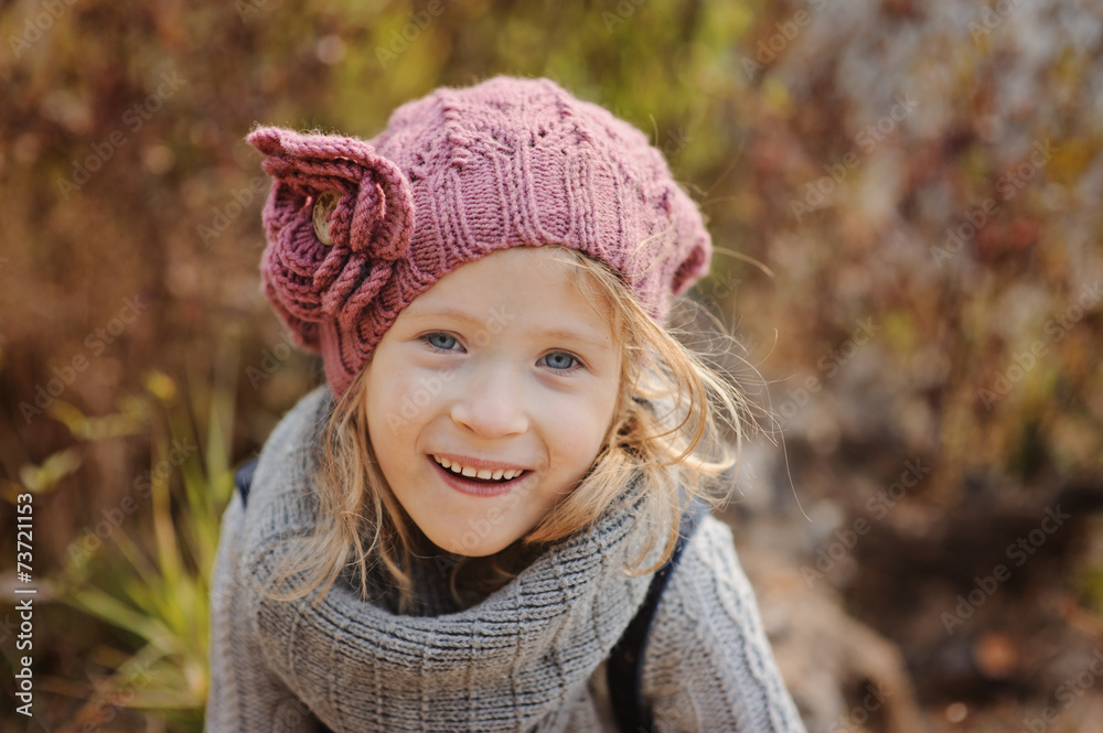 Cute happy child girl on the river side in autumn sunny day Cute happy child girl on the river side in autumn sunny day