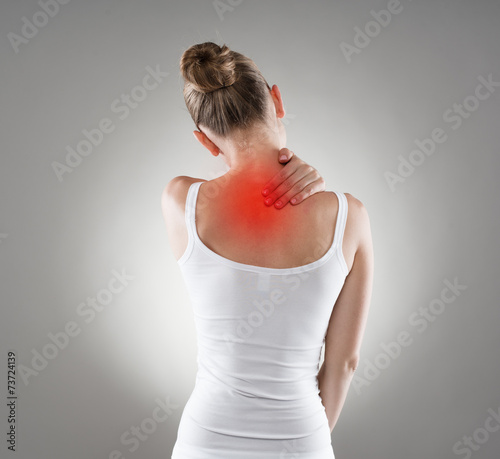 Billede på lærred Neck cramp. Young woman having back illness.