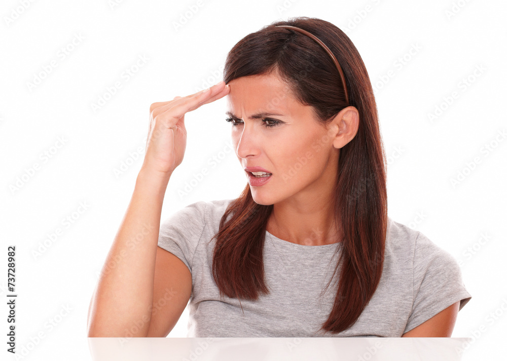 Young lady looking sick with headache Young lady looking sick with headache