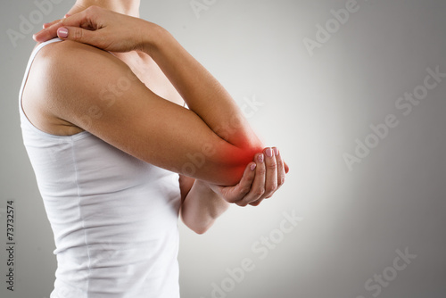Woman suffering from chronic joint rheumatism photo