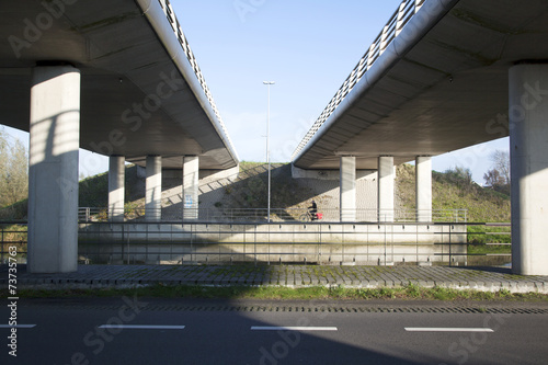 man on bicycle near De Meern under fly-over