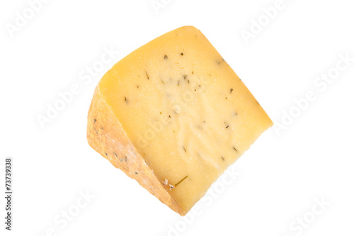 triangular piece of cheese with herbs isolated on a white backgr