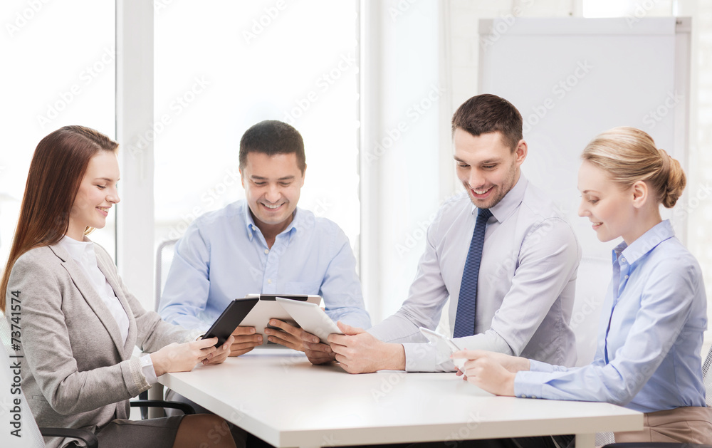 business team working with tablet pc in office business team working with tablet pc in office