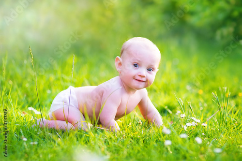 Baby boy crawling in the garden © famveldman