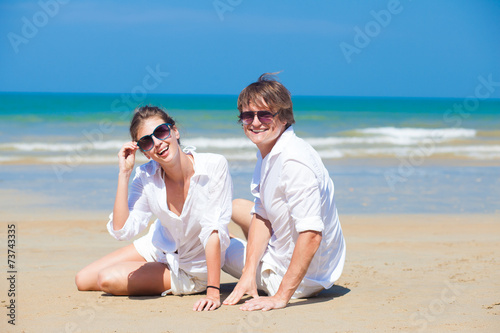 young happy couple having fun on tropical beach. honeymoon © el.rudakova