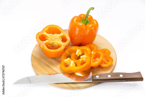 pepper on a cutting board and knife