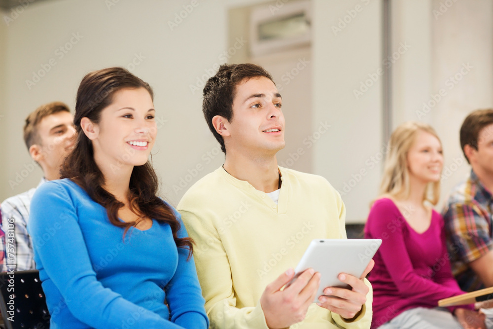 group of smiling students with tablet pc group of smiling students with tablet pc