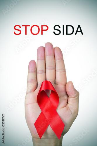 text stop SIDA, stop AIDS in spanish, french or portuguese, and photo