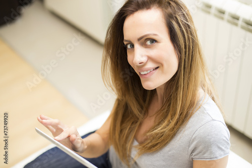 Young woman with tablet at ...