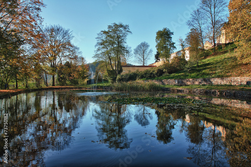 Autumn park with reflection