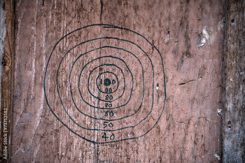 hand drawn dartboard on a wooden board hand drawn dartboard on a wooden board
