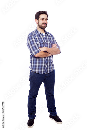 Full body portrait of young casual man smiling, isolated on whit