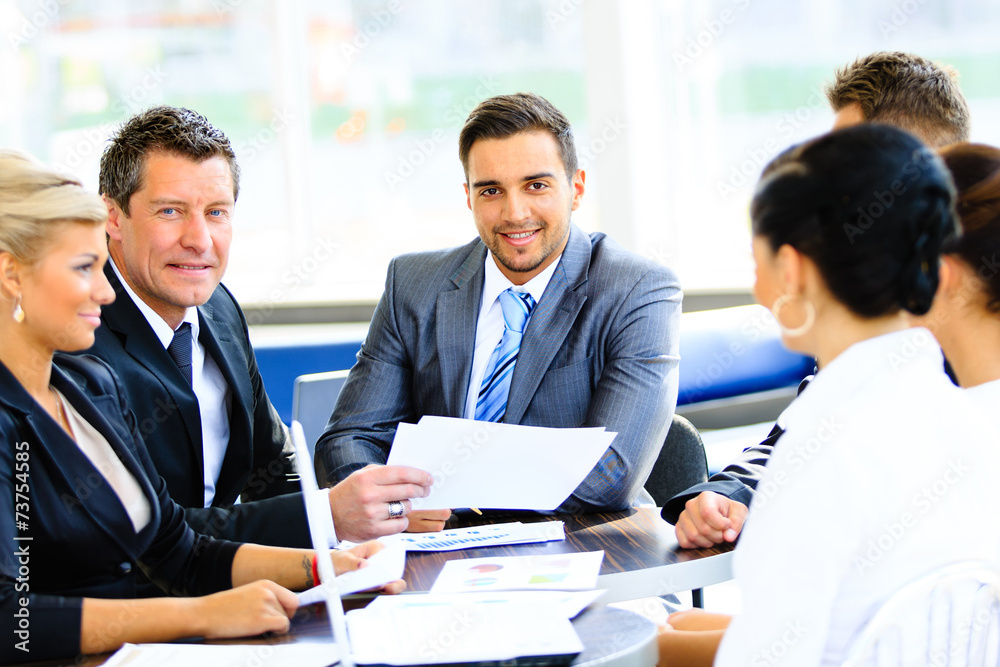 Portrait of young handsome businessman in office Portrait of young handsome businessman in office