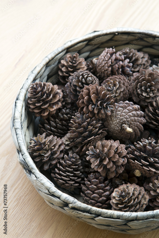 The cones ornament in woven bowl The cones ornament in woven bowl