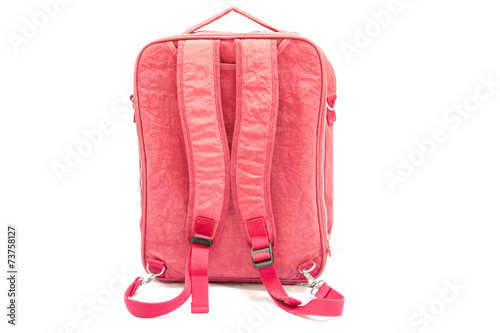 Pink backpack standing isolated on white background