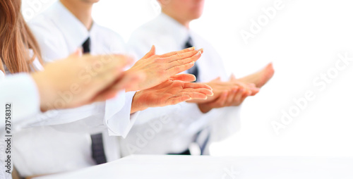 Close-up of business people clapping hands. © yurolaitsalbert