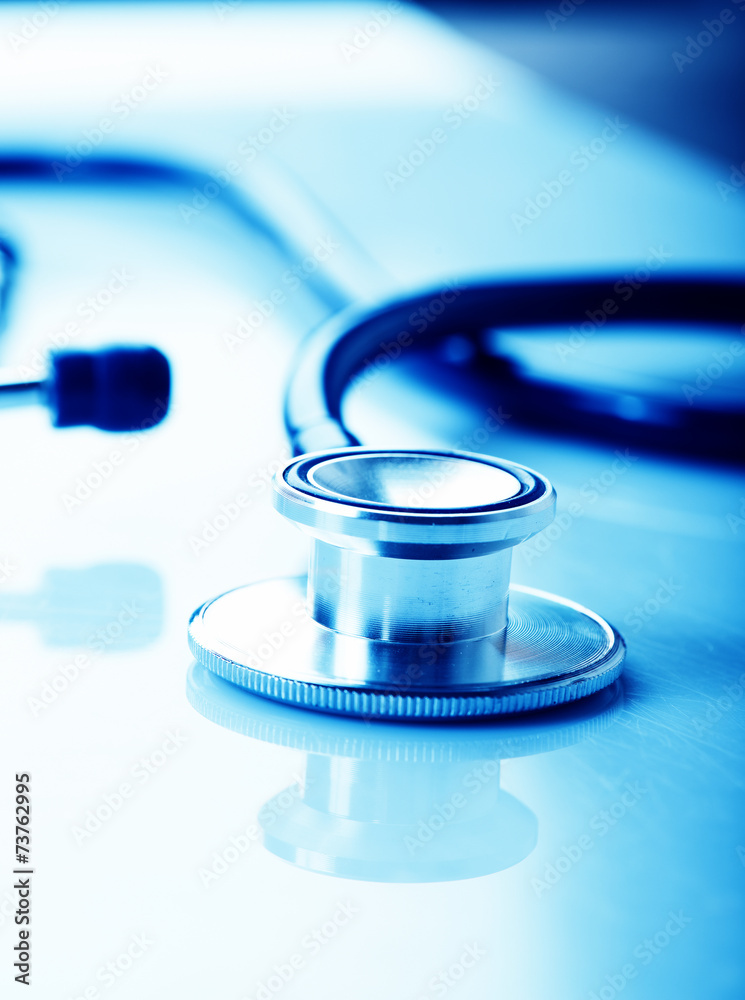 Stethoscope on blue background Stethoscope on blue background