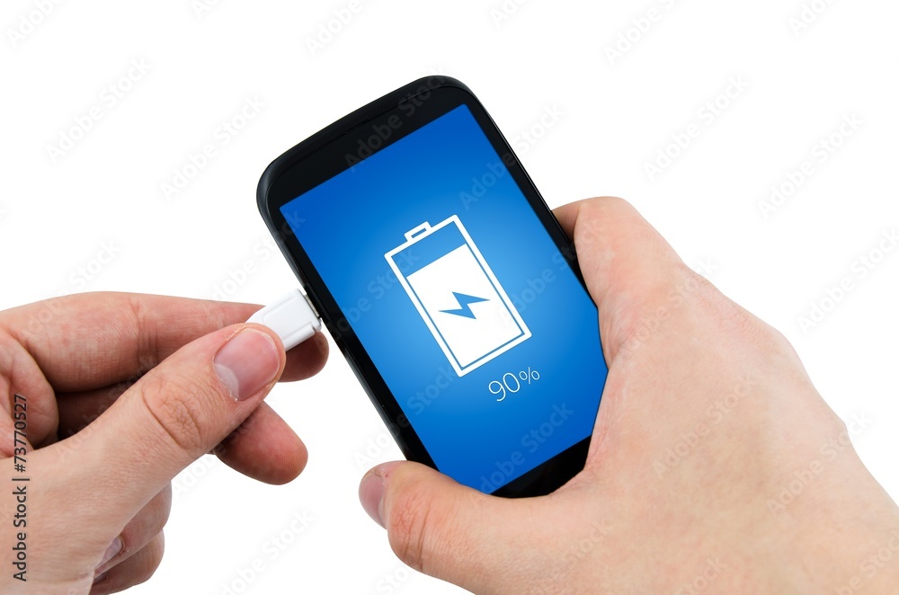 Man using phone charger via USB Man using phone charger via USB