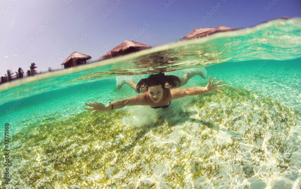 Healthy woman swimming in the ocean