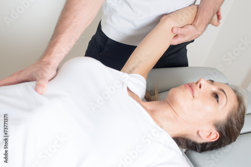 female patient with physical therapist