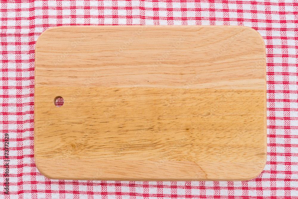 wood cutting board on tablecloth wood cutting board on tablecloth