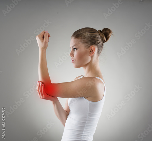 Young girl having hurt elbow. Bone dislocation concept.