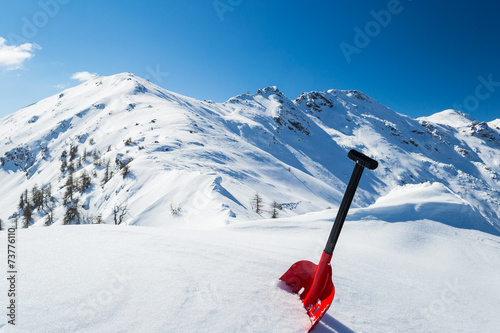 Avalanche shovel in the snow photo