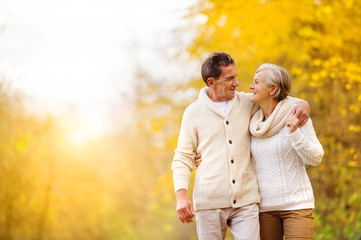 Active seniors walk in nature