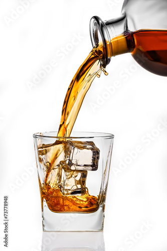 whiskey being poured into a glass © Aleks_ei