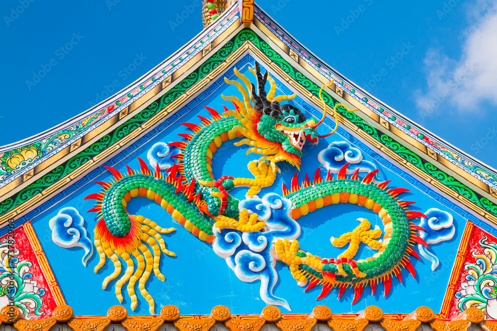 Chinese style dragon statue on temple roof