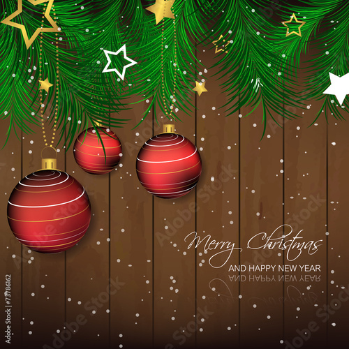 Christmas background with bauble, pine needles, wooden texture