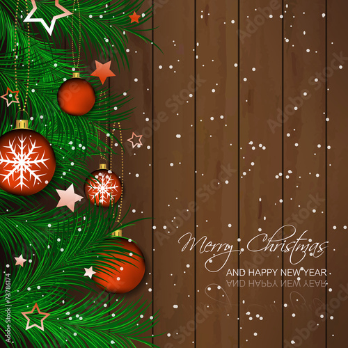 Christmas background with bauble, pine needles, wooden texture